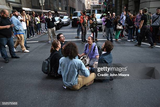 Protesters block a street near Wall Street during the one-year anniversary of the Occupy Wall Street movement on September 17, 2012 in New York City....