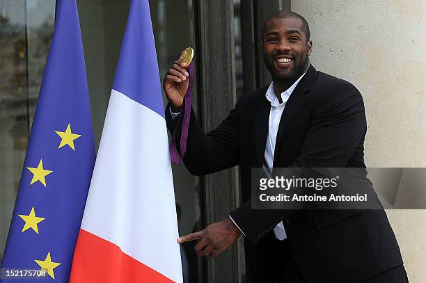 France's Gold Olympic judo athlete Teddy Riner arrives for a ceremony with France's President Francois Hollande at Elysee Palace on September 17,...