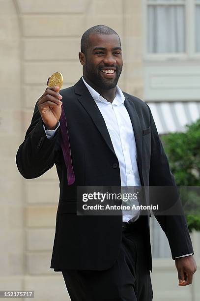 France's Gold Olympic judo athlete Teddy Riner arrives for a ceremony with France's President Francois Hollande at Elysee Palace on September 17,...