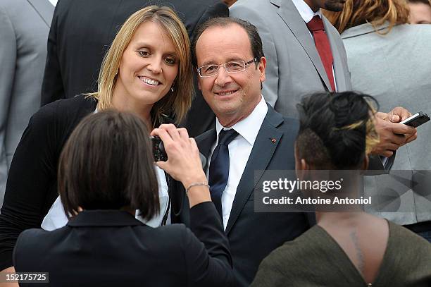 France's President Francois Hollande poses for a picture with a French Olympic athlete at Elysee Palace on September 17, 2012 in Paris, France.