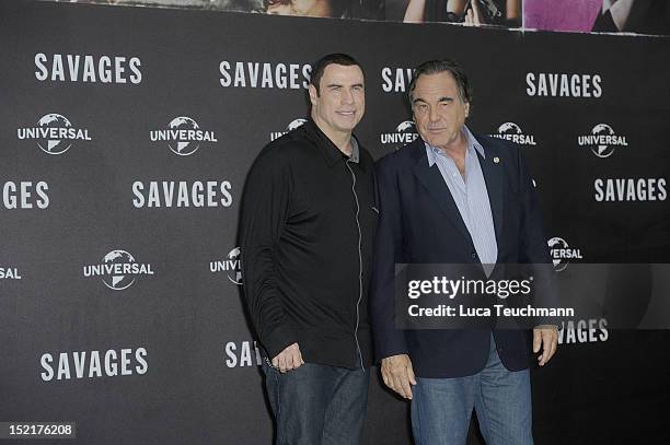 John Travolta and Oliver Stone attends the 'Savages' photocall "Savages" at Hotel Adlon on September 17, 2012 in Berlin, Germany.