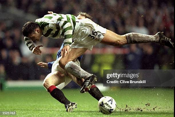 Craig Moore of Glasgow Rangers tackles Mark Viduka of Glasgow Celtic during the Scottish Premier Division game between Glasgow Celtic and Glasgow...