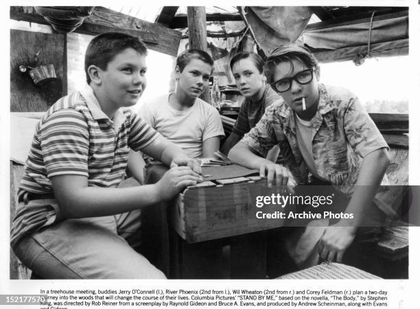 Jerry O'Connell, River Phoenix, Wil Wheaton, and Corey Feldman are gathered around together in a scene from the film 'Stand By Me', 1986.