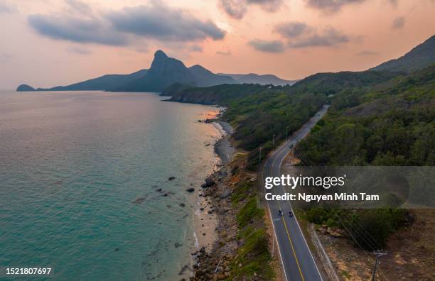 sunset on nhat beach and love mountain in con dao, one of the most beautiful landscapes in con dao, ba ria vung tau province - vung tau vietnam stockfoto's en -beelden