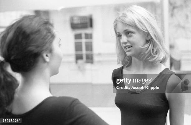 American dancer, and future actress, Goldie Hawn talks to a fellow class member during a practice session at the Wally Saunders Dance Studio,...