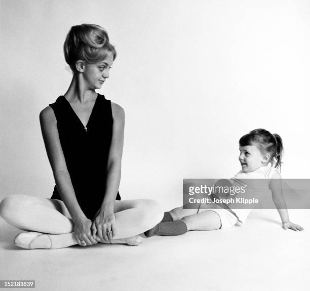 American dancer and dance instructor, and future actress, Goldie Hawn poses with one of her young ballet students, Arlington, Virginia, September 29,...
