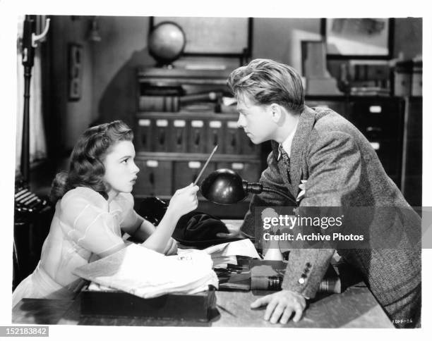 Judy Garland pointing pencil at Mickey Rooney in a scene from the film 'Babes On Broadway', 1941.