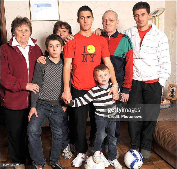Eden Hazard poses at home with his family Nicole his grandmother, Kylian his brother, Carine his mother, Ethan his brother, Francis his grandfather...