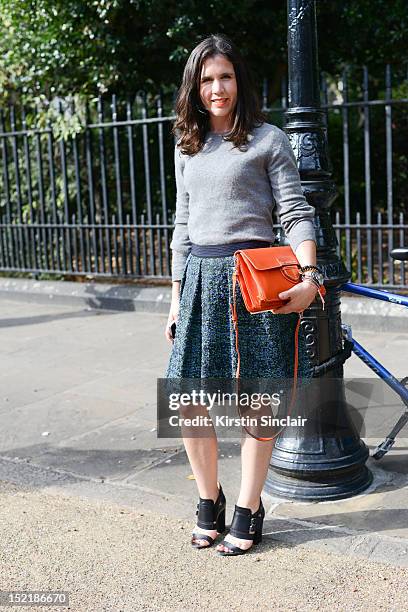 Karen Preston fashion Editor at Glamour Magazine Uk, wearing a Prada bag, Givenchy shoes, on day 3 of London Fashion Week Spring/Summer 2013, on...