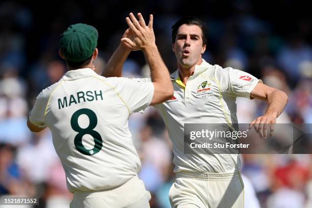 Pat Cummins of Australia celebrates with Mitchell Marsh after dismissing Joe Root of England during Day Two of the LV= Insurance Ashes 3rd Test Match...