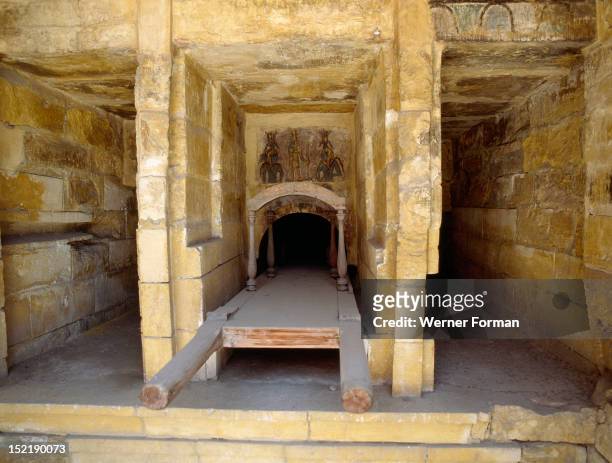 The extensive complex of burial chambers at Kom el-Shuqafa, Remnants of painting in the Egyptian funerary tradition are visible in the centre of the...