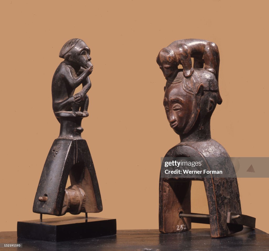 Heddle pulley used to support the cord to the foot pedals which alternate the heddles on the narrow strip loom typical of West African mens weaving