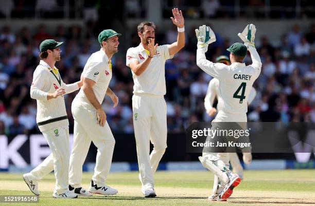 Mitchell Starc of Australia celebrates with Alex Carey after dismissing Jonathan Bairstow of England during Day Two of the LV= Insurance Ashes 3rd...