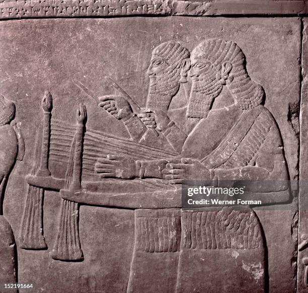 Stone relief from the palace of Sennacherib, Musicians lead a religious procession to the temple of Ishtar. Assyrian. Late Assyrian 705 681 BC....