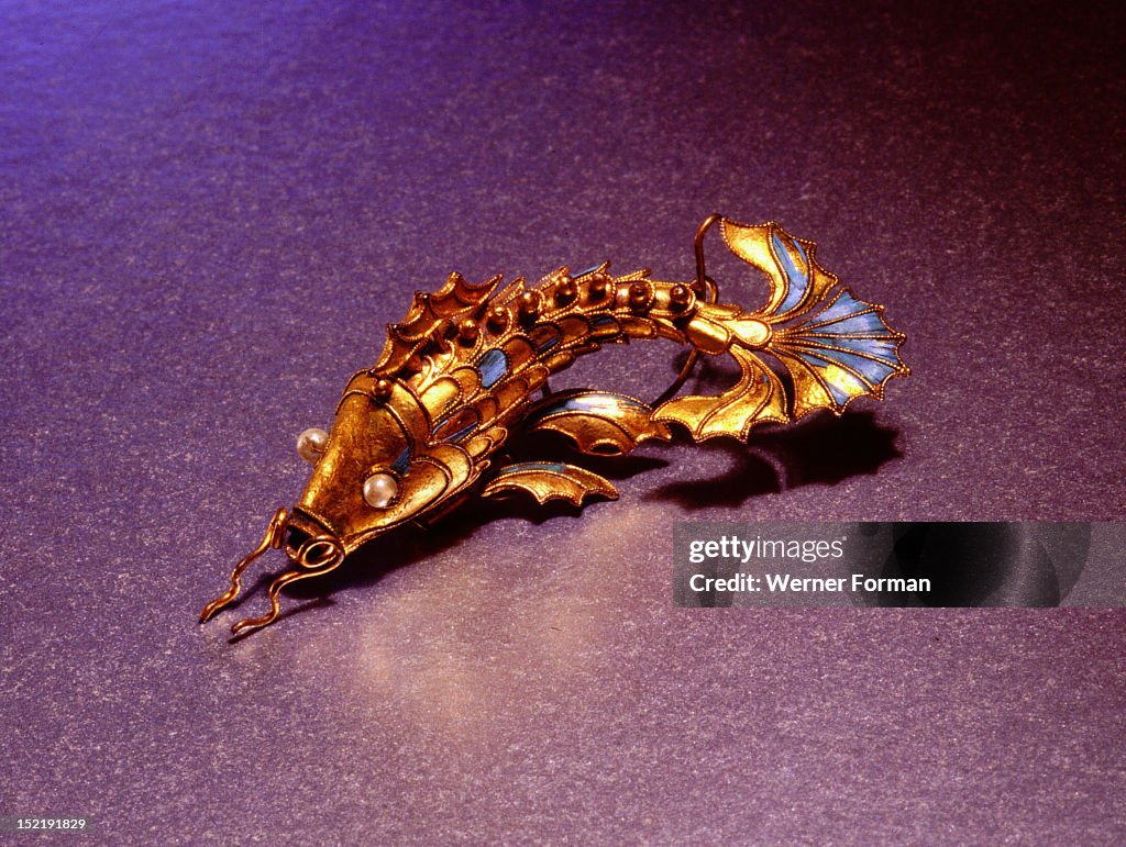 Silver gilt fish mounted on a hairpin