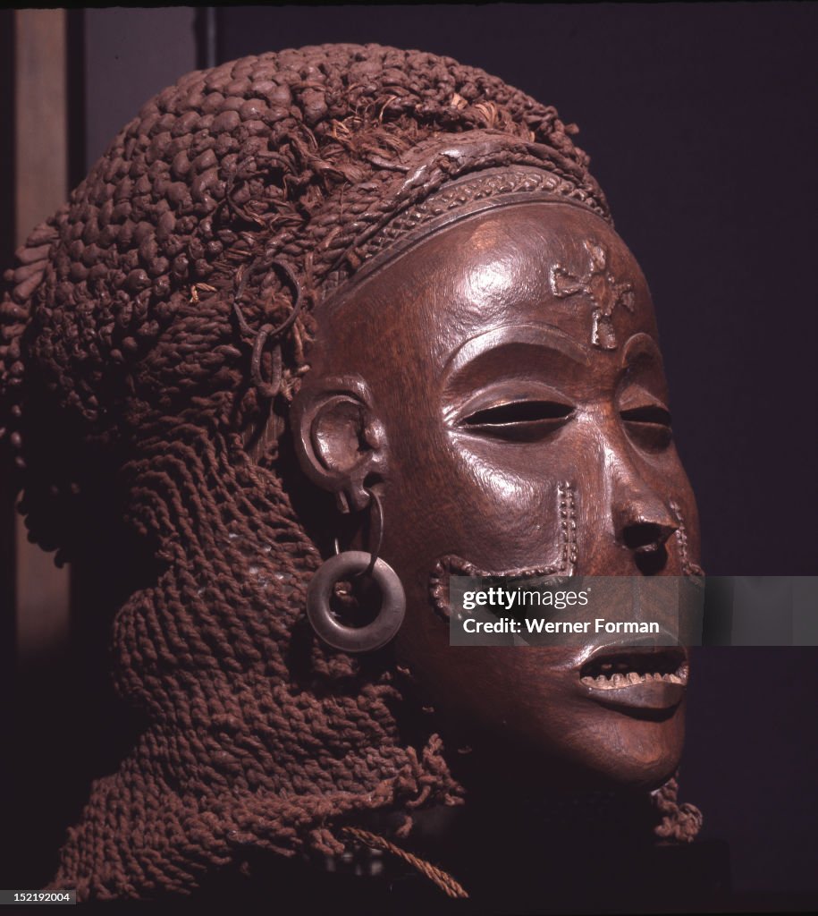 Dance mask of a type known as Mwana Pwo, regarded as an idealised depiction of a beautiful young girl, showing facial scarifications