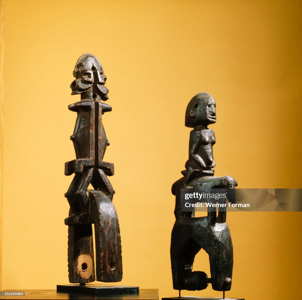 Heddle pulley used to support the cord to the foot pedals which alternate the heddles on the narrow strip loom typical of West African mens weaving