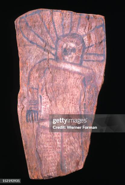 Bark painting depicting a Wandjina, The Wandjina are a group of ancestral beings from the sea and sky that bring rain and control the fertility of...
