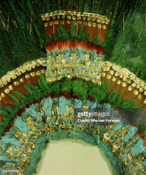 Detail of the gold and featherwork headdress given by Montezuma to Cortes as a gift for his sovereign, Mexico. Aztec.