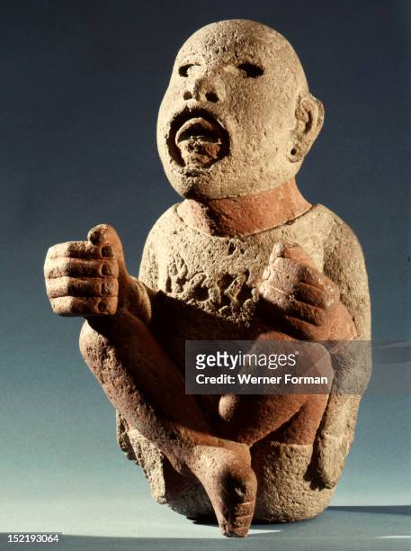 Xipe Totec, the Flayed Lord, dressed in the skin of a sacrificial victim, During the agricultural festival of Tlacaxipeualiztli a sacrificial victim...