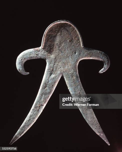 Anthropomorpic figure from a copper hoard, probably used as a cult object, Such hoards are often found in the banks of streams in Northern India and...