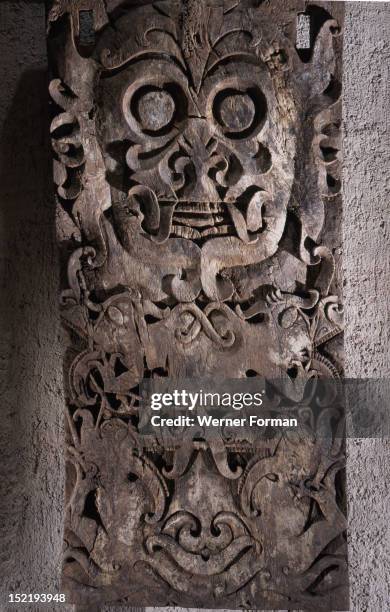 Carved panel, originally from a funerary edifice, Four aso face one another below an goggle eyed udoq . Mythical narratives , which explain the deeds...