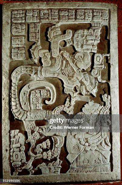 Lintel 25 of Yaxchilan Structure 23, showing accession rituals of the ruler Shield Jaguar , The blood sacrifice by his wife Lady Xoc has conjured up...