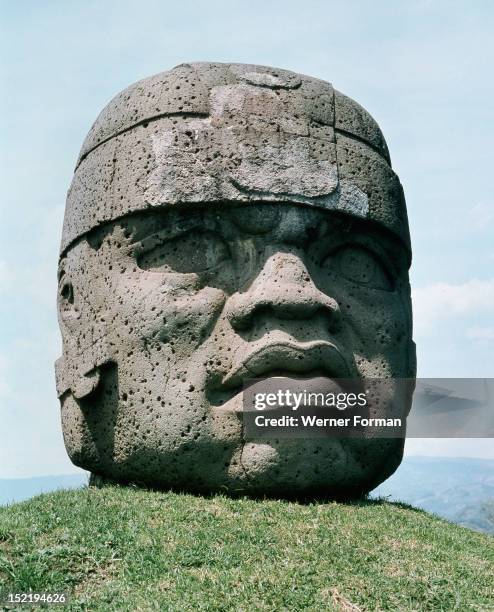 Massive stone head, possibly representing a planetary deity oran individual ruler, possibly deified and worshipped as ancestor , Mexico. Olmec.