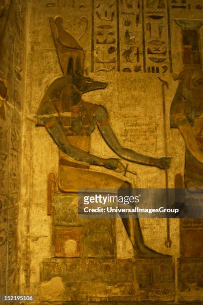 Ptolemaic temple of Hathor and Maat, Polychrome reliefs that decorate the interior, Anubis, Seated figure, Deir el-Medina, Egypt.