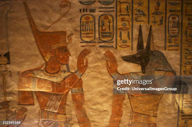 Tomb of Amen Khopshef, son of Ramses III, Polychrome reliefs decorating the walls of the burial chamber, God Anubis on the right, Twentieth dynasty,...