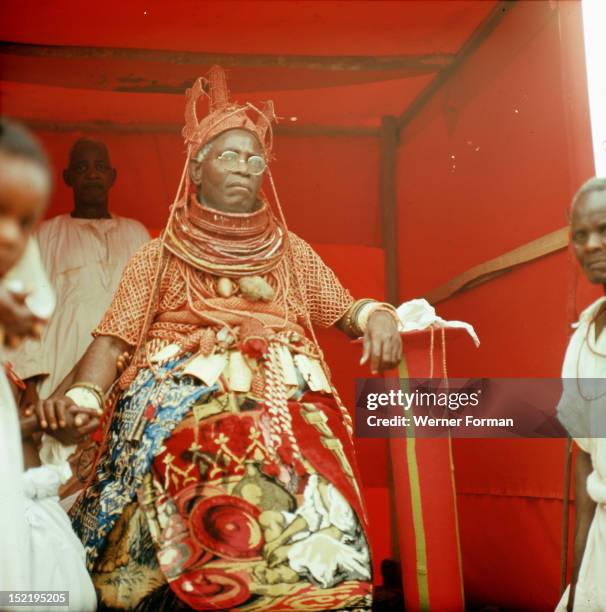 The late Oba Akenzua II in full regalia, including a coral garment and headpiece, Coral is an important symbol of the identity of the Oba, ruler of...