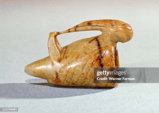 Tobacco spread from Virginia to Europe, finally reaching the Eskimos via Russian traders from Alaska, This early historical Huron effigy pipe bowl...