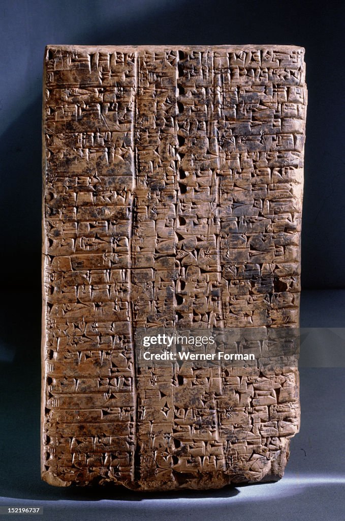 Ur III clay administrative tablet, impressed with the scribes seal, which depicts a goddess leading a worshipper and the text Ur Gigir, scribe, son of Barran