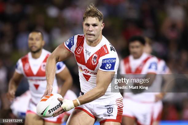 Jack de Belin of the Dragons passes the ball during the round 19 NRL match between St George Illawarra Dragons and Canberra Raiders at WIN Stadium on...