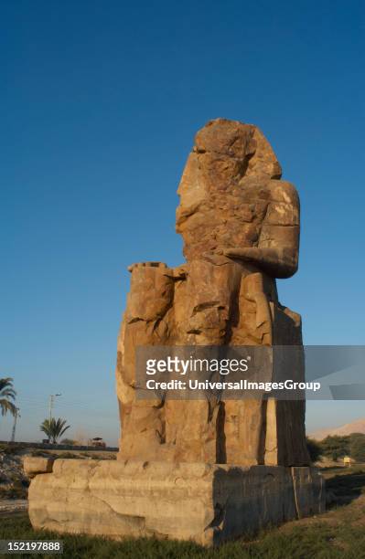 Colossi of Memnon, Stone statues depicting pharaoh Amenhotep III in a seated position, Western colossus, Eighteenth Dynasty, New Kingdom, Luxor,...