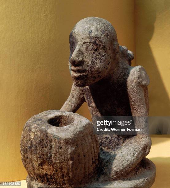 Stone effigy pipe in the form of a maize grinder with mortar, Smoking had religious overtones for prehistoric Indians. Elaborate pipes such as this...