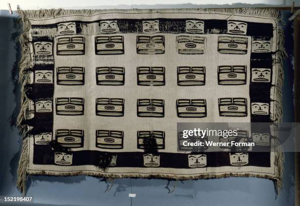 Woven Chilkat blanket which is unusual in that it is made of pure wool and not a mixture of wool and cedar bark, Such blankets were the most valuable...