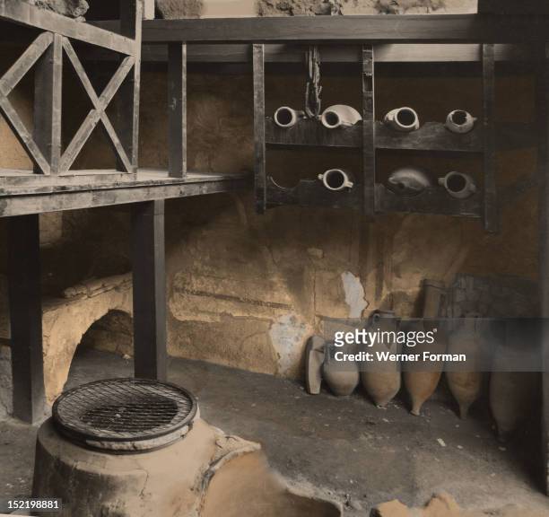 Shop for wine and cereals attached to the 'House of the Neptune Mosaic', View of the storage room with the wine amphoras. Italy. Roman. Herculaneum.