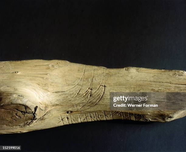 Three Viking ship prows incised on a piece of wood, Plus inscription. Norway. Viking.