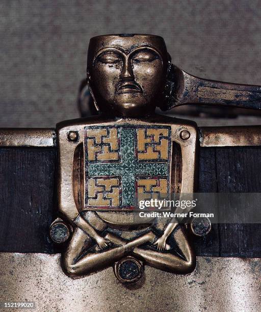 Figure of Hiberno Saxon origin on the handle of a bucket with swastika symbols of Thor, Norway. Viking. 1st half of 9th c .