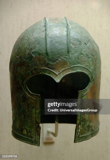 Archaic bronze helmet of Corinthian type, Dated to 700-675 b.C, Museum of Cycladic and Ancient Greek Art, Athens, Greece.