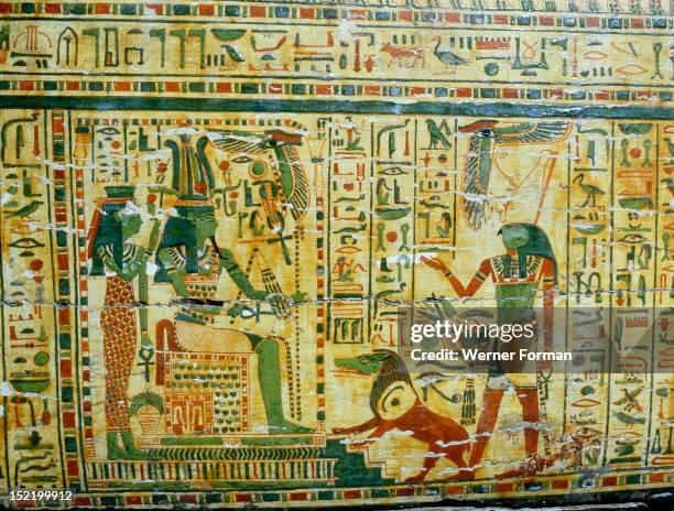 Detail from coffin of Nespawershepi, chief scribe of the Temple of Amun, Osiris, Isis, Horus and the beast that devoured the hearts of the dead that...