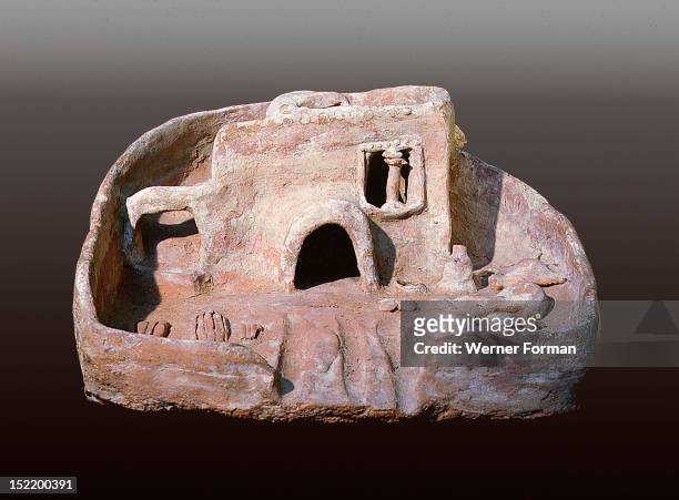 Model of a house with a rounded door and a staircase to the roof which has a vent to catch the cool breeze, Funerary models like these, which...