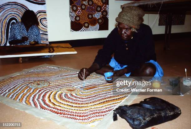 Balgo Community artist, the late Mati Mudgedell, working on a dot painting at the Warlayirti Culture Centre in the north-west desert region of...