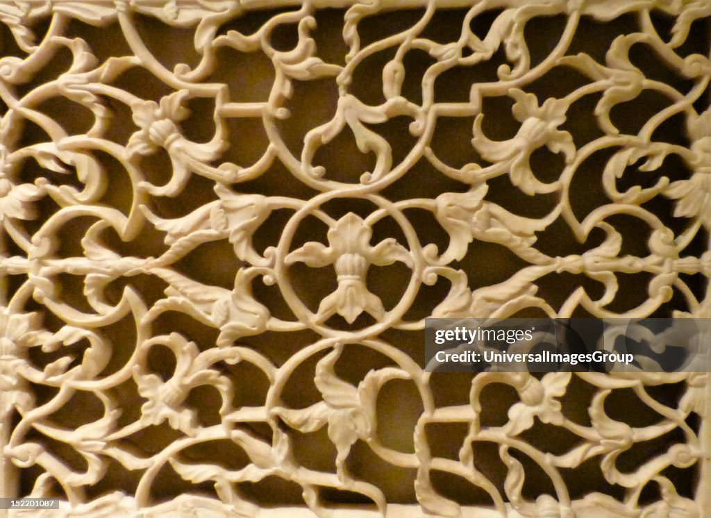 Panel. Marble inlaid with yellow and black marble and cornelian, c1880 after a Mughal original of 1628. The decoration on this panel was probably copies from a detail on the tomb of I' mad ad-Duala at Agra, completed in 1628.
