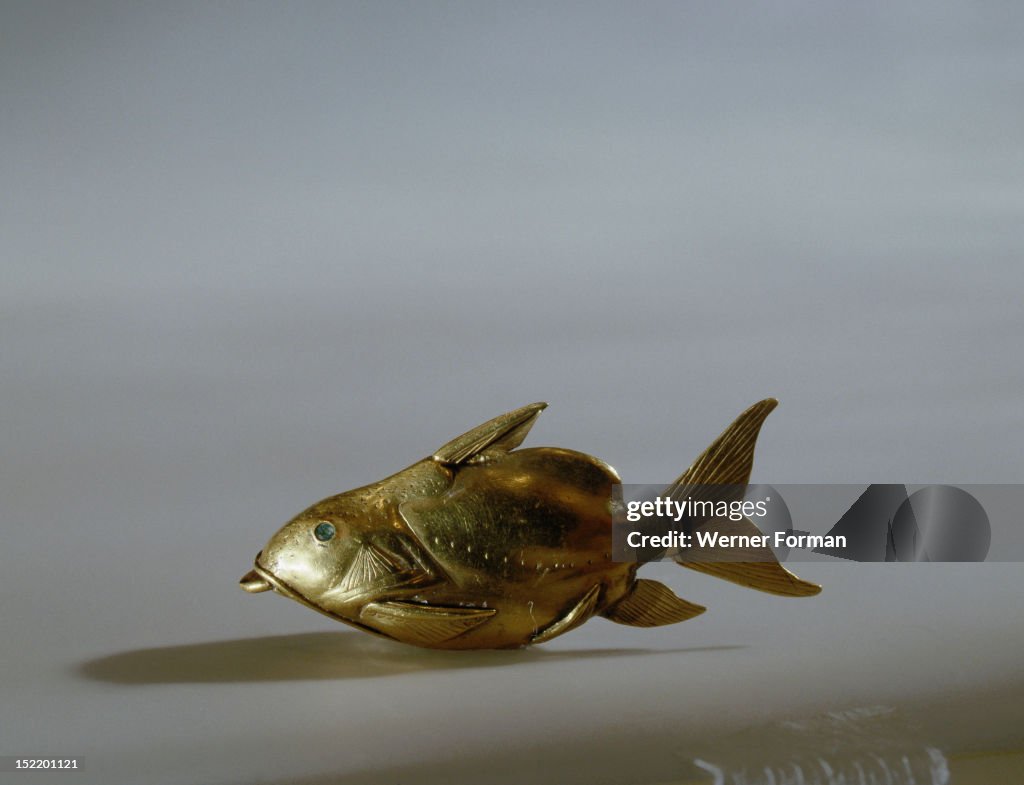 Gold fish amulet, nekhau, worn by young women attached to the hair to protect against drowning