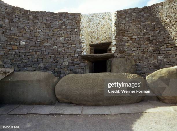 The incised entrance stone in front of the mouth of the passage to the burial chamber at Newgrange, During the winter solstice ancestral cult...