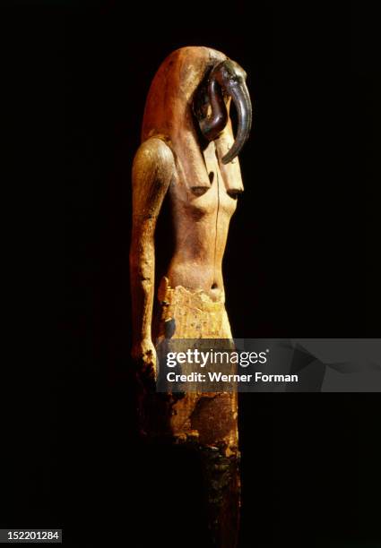 Statue of the patron of writing and scribal wisdom, the god Thoth, He is represented as a striding man with bronze ibis head. Egypt. Ancient...