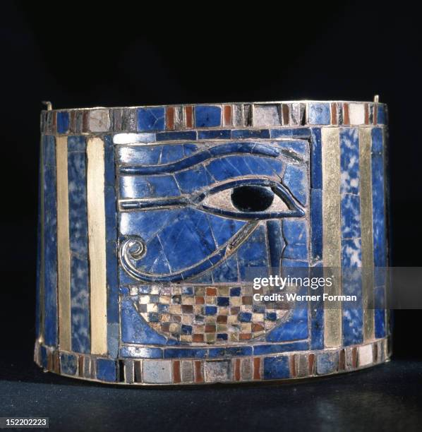 One of a pair of bracelets found on Shoshenq IIs body with representations of the Wedjat eye upon a basket, The eyes are depictions of the eyes of...