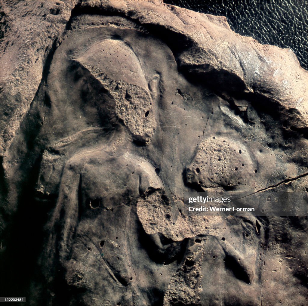 A unfinished relief fragment with the figures of Akhenaten and a child